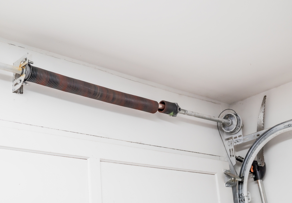 Broken,Garage,Door,Spring,Or,Torsion,Spring,From,Overhead,Sectional