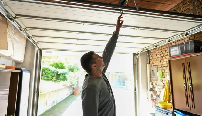 person reaching for garage door